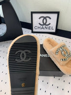 CHANEL THICK-SOLED SLIPPERS IN BRIGHT CREAM SHEEP WOOL
