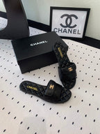 CHANEL SLIPPERS IN BLACK CALFSKIN