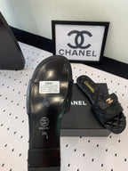 CHANEL SLIPPERS IN BLACK CALFSKIN