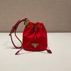 PRADA MINI BUCKET BAG 10 IN RED RE-NYLON AND SAFFIANO LEATHER STRAP