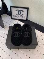 CHANEL FLAT MULE IN BLACK SUEDE AND LAMB FUR LINING