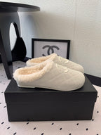 CHANEL FLAT MULE IN BEIGE SUEDE AND LAMB FUR LINING