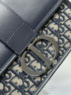 DIOR MONTAIGNE EAST-WEST BAG 24 IN BLACK LAMBSKIN AND MONOGRAM OBLIQUE JACQUARD