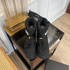 CHANEL SKI BOOTS IN BLACK QUILTED COTTON