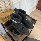 CHANEL SKI BOOTS IN BLACK QUILTED COTTON