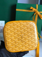PETIT FLOT BUCKET BAG 22 IN YELLOW GOYARDINE CANVAS AND LAMBSKIN TRIM
