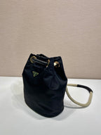 PRADA BUCKET BAG 28 IN BLACK RE-NYLON GOLD LOGO
