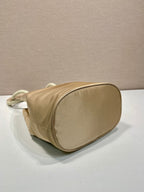 PRADA BUCKET BAG 28 IN BEIGE RE-NYLON GOLD LOGO