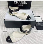 CHANEL CLASSIC MARY JANE FLATS IN WHITE AND BLACK QUILTED CALFSKIN