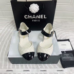 CHANEL CLASSIC MARY JANE FLATS IN WHITE AND BLACK QUILTED CALFSKIN