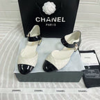 CHANEL CLASSIC MARY JANE FLATS IN WHITE AND BLACK QUILTED CALFSKIN