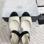CHANEL CLASSIC MARY JANE FLATS IN WHITE AND BLACK QUILTED CALFSKIN
