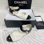 CHANEL CLASSIC MARY JANE FLATS IN WHITE AND BLACK QUILTED CALFSKIN