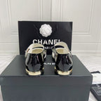 CHANEL CLASSIC MARY JANE FLATS IN WHITE AND BLACK QUILTED CALFSKIN