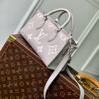 LOUIS VUITTON ONTHEGO EAST WEST BAG 25 IN BICOLOR MONOGRAM EMPREINTE LEATHER