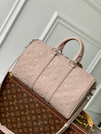 LOUIS VUITTON KEEPALL BANDOULIÈRE 34 BAG IN LIGHT BROWN MONOGRAM TAURILLON CALFSKIN