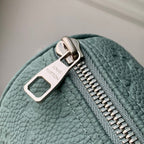 LOUIS VUITTON KEEPALL BANDOULIÈRE 25 BAG IN MISTY LAKE GREEN MONOGRAM TAURILLON CALFSKIN