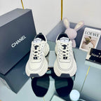CHANEL TRAINERS SNEAKER IN WHITE CALFSKIN WITH BLACK EMBROIDERED