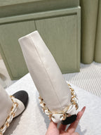 CHANEL 25S CALF-LENGTH BOOTS 45MM IN WHITE AND BLACK CALFSKIN GOLD HARDWARE