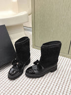 CHANEL 25S ANKLE BOOTS IN BLACK SHEARLING LAMBSKIN AND PATENT CALFSKIN
