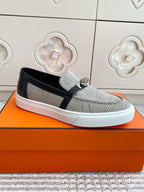 HERMES 25S SLIP-ON IN GREY CANVAS AND BLACK LAMBSKIN WITH SILVER HARDWARE
