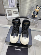 CHANEL MARTIN BOOTS IN BLACK CALFSKIN AND LAMB FUR LINING