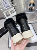 CHANEL MARTIN BOOTS IN BLACK CALFSKIN AND LAMB FUR LINING