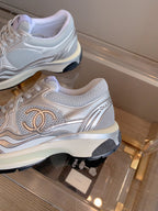 CHANEL SNEAKERS IN GLOSSY SILVER CALFSKIN AND MESH