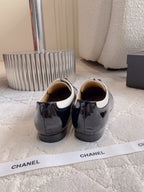 CHANEL 25S TWO TONE LACE UP IN BLACK AND WHITE SHINY CALFSKIN