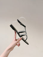 CHANEL SANDALS PEARL ROMAN IN BLACK LAMBSKIN