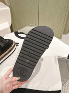 CHANEL SLIPPERS WITH SILK BOW IN BLACK COWHIDE