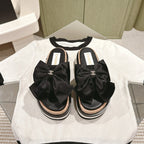 CHANEL SLIPPERS WITH SILK BOW IN BLACK COWHIDE