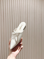 CHANEL FLAT MULES 25S IN WHITE PATENT LEATHER
