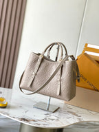 LOUIS VUITTON BABYLONE TOTE 31 IN TOURTERELLE MONOGRAM EMPREINTE LEATHER
