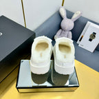 CHANEL THICK-SOLED SLIDE IN WHITE LAMBSKIN AND WOOL LINING