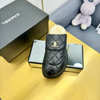 CHANEL THICK-SOLED SLIDE IN BLACK LAMBSKIN AND WOOL LINING