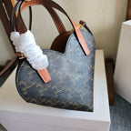 CELINE 25S TEEN COEUR BAG 19 MM IN BLACK TRIOMPHE CANVAS AND TAN CALFSKIN