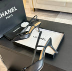 CHANEL SLINGBACK WITH BOW IN BLACK LAMBSKIN