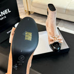 CHANEL SHORT BOOTS IN PEACH PINK VELVET AND BLACK LAMBSKIN