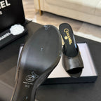 CHANEL T-STRAP PEARL HEEL 85 MM SANDALS IN BLACK LAMBSKIN MULE