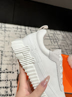 HERMES BOUNCING SNEAKER IN WHITE CALFSKIN AND FABRIC