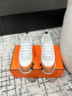 HERMES BOUNCING SNEAKER IN BRONZE BROWN CALFSKIN AND WHITE FABRIC