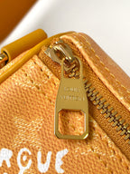 LOUIS VUITTON KEEPALL BANDOULIÈRE 25 IN ORANGE MONOGRAM HERITAGE CANVAS