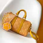 LOUIS VUITTON KEEPALL BANDOULIÈRE 25 IN ORANGE MONOGRAM HERITAGE CANVAS