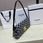 CELINE LOLA BAGUETTE BAG 28 IN BLACK MIX WHITE MONOGRAM CANVAS AND CALFSKIN
