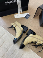 CHANEL ALPHABET MARTIN BOOTS IN FLAX YELLOW LAMBSKIN