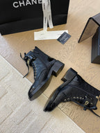 CHANEL ALPHABET MARTIN BOOTS IN BLACK LAMBSKIN