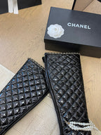 CHANEL KNEE HIGH BOOTS 8 CM IN BLACK CALFSKIN WITH PEARL CHAIN