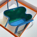 HERMES GARDEN PARTY 30CM IN WHITE TOILETS COTTON CANVAS AND BLUE CALFSKIN GREEN ON SIDE OTHER