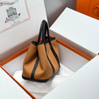 HERMES GARDEN PARTY 30CM IN ORANGE MINIMUM TOILETS COTTON CANVAS AND BLACK CALFSKIN